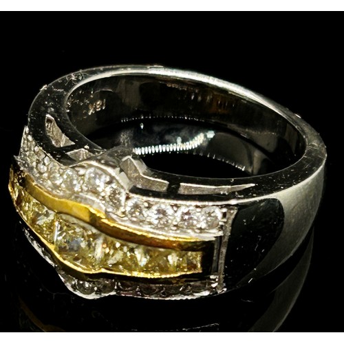 1371 - An 18ct white gold, fancy yellow and white diamond dress ring, with yellow gold mount enclosing seve... 