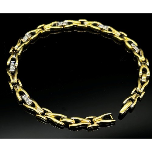 1370 - An 18ct yellow gold link bracelet, the links interspersed with six diamond couplings, 20cm long, sta... 