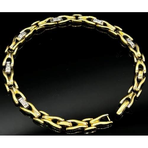 1370 - An 18ct yellow gold link bracelet, the links interspersed with six diamond couplings, 20cm long, sta... 