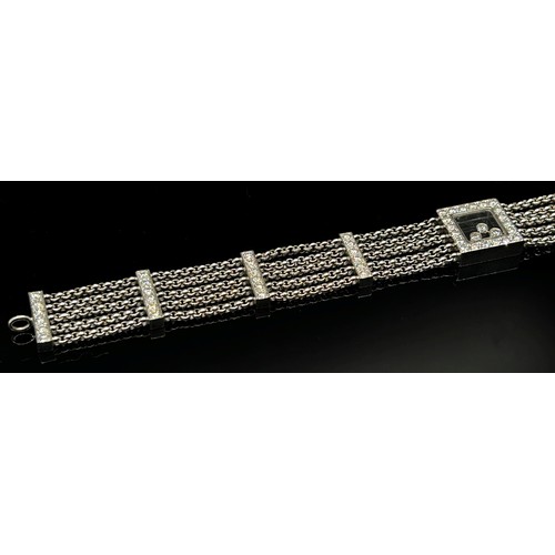 1369 - Chopard. An 18ct white gold ‘Happy Diamonds’ bracelet, on a five strand chain bracelet spaced with d... 