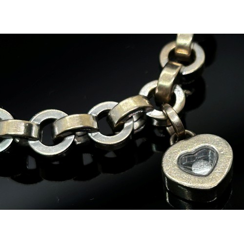 1368 - Chopard. an 18ct white gold ‘Happy Diamonds’ bracelet, with single diamond in a love heart shaped su... 