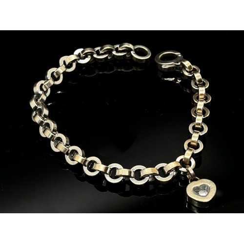 1368 - Chopard. an 18ct white gold ‘Happy Diamonds’ bracelet, with single diamond in a love heart shaped su... 