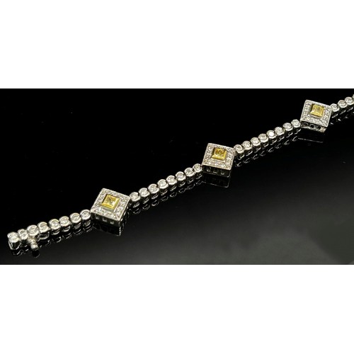 1367 - A demi-parure of 18ct white gold, white and yellow diamond jewellery, comprising bracelet and pair o... 