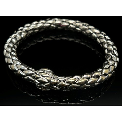 1379 - Chimento. An 18ct white gold ‘stretch’ bracelet, marked Chimento, 750, 21cm long, 34g (boxed).