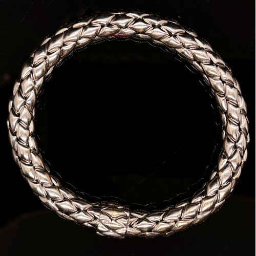 1379 - Chimento. An 18ct white gold ‘stretch’ bracelet, marked Chimento, 750, 21cm long, 34g (boxed).