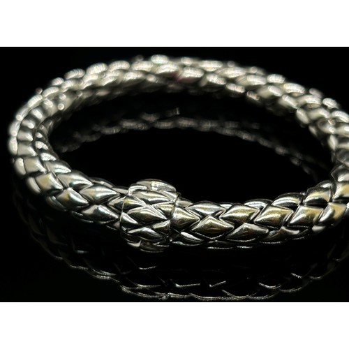 1379 - Chimento. An 18ct white gold ‘stretch’ bracelet, marked Chimento, 750, 21cm long, 34g (boxed).