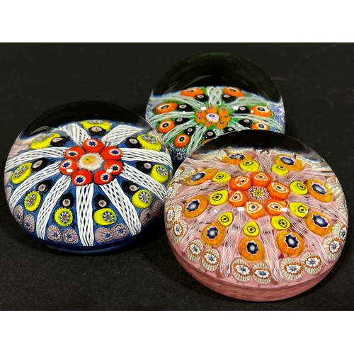 162 - Three Millefiori multicoloured cane paperweights in the Monart style.