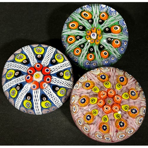 162 - Three Millefiori multicoloured cane paperweights in the Monart style.