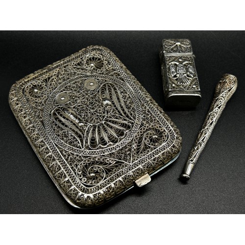 249 - A fine Filigree silver cigarette case from India, together with a matching lighter and cigarette hol... 