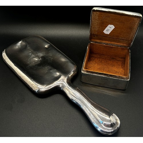 253 - A silver hand mirror and a silver cigarette box, both (af) (2)