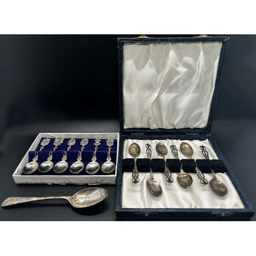 261 - A boxed set of six silver coffee spoons, a boxed set of six silver collectors spoons and a single si... 