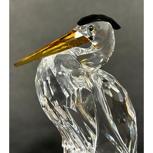 163 - Two Swarovski crystal animals a giraffe and a Heron, a further group of Swarovski miniature pieces w... 