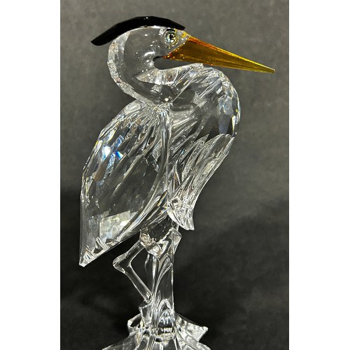 163 - Two Swarovski crystal animals a giraffe and a Heron, a further group of Swarovski miniature pieces w... 