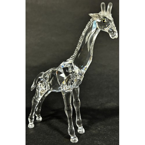 163 - Two Swarovski crystal animals a giraffe and a Heron, a further group of Swarovski miniature pieces w... 