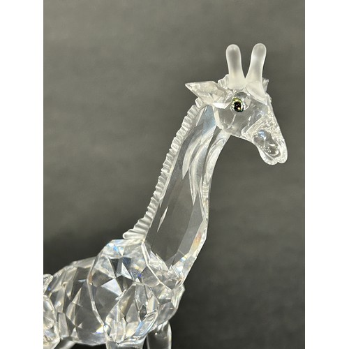 163 - Two Swarovski crystal animals a giraffe and a Heron, a further group of Swarovski miniature pieces w... 