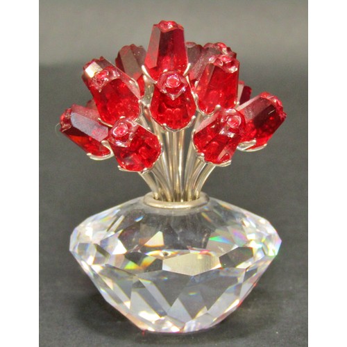 165 - Swarovski crystal ornaments including a mouse, a vase of roses, a row of three tulips, a petal head,... 