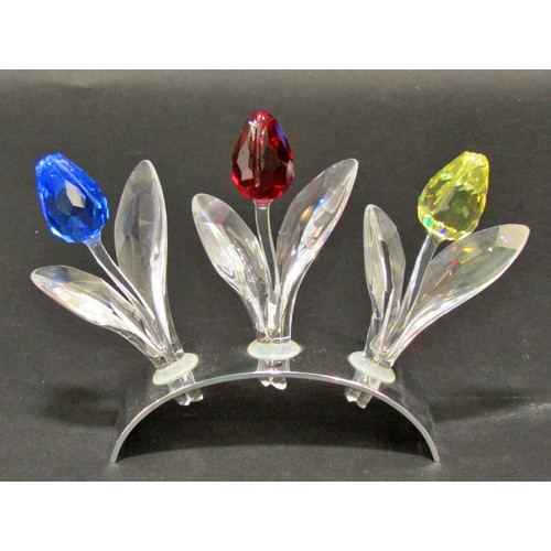 165 - Swarovski crystal ornaments including a mouse, a vase of roses, a row of three tulips, a petal head,... 