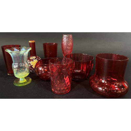 177 - A collection of Victorian Cranberry glass to include condiments, glass beakers, glasses, small bowls... 