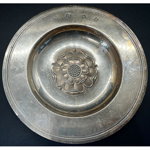 288 - A silver plate with central rose decoration, London 1968, maker Tessiers Ltd, 17 cm diameter, a silv... 