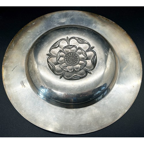 288 - A silver plate with central rose decoration, London 1968, maker Tessiers Ltd, 17 cm diameter, a silv... 