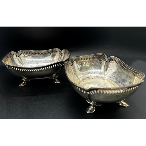 294 - A pair of silver bon bon dishes with pierced sides raised on pad feet, Sheffield 1919 makers Atkin B... 