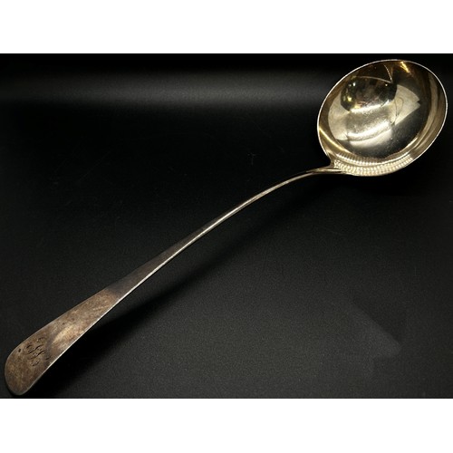 296 - A George III silver ladle, London 1812, maker Peter & William Bateman, 33 cm long and a Georgian sil... 