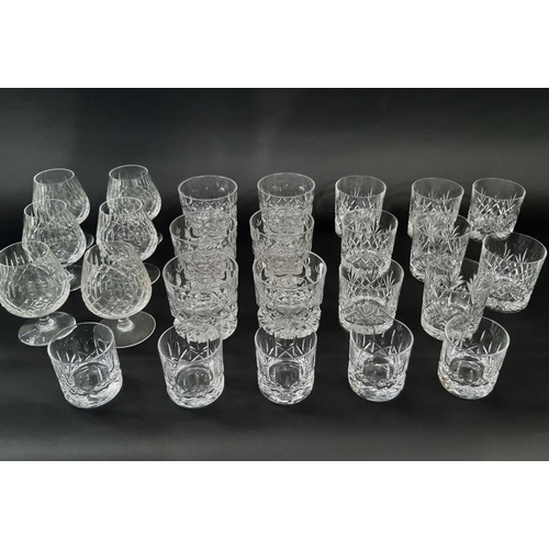 169 - A selection of clear cut glass whiskey tumblers of various shapes and sizes and six brandy bowls