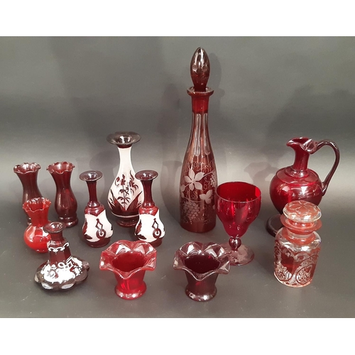 173 - A mixed selection of Cranberry and Bohemian red glassware including decanters, vases, a jug, and a l... 