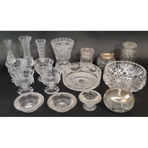 175 - A mixed selection of clear cut glass, including fruit bowls, vases, dessert bowls, jars etc.