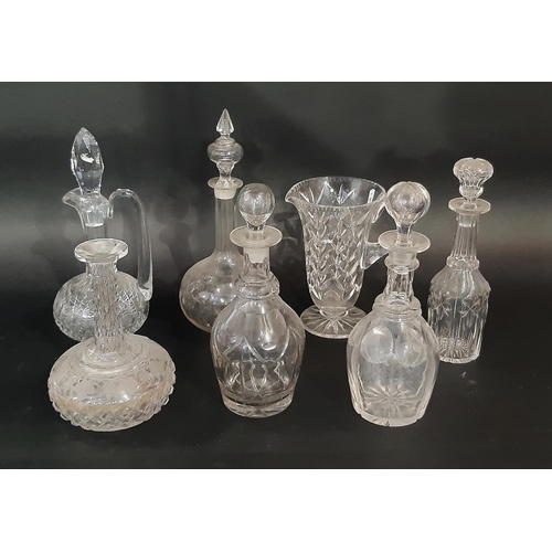 187 - A collection of late 19th and early 20th century cut glass decanters, of varying shapes and sizes, f... 