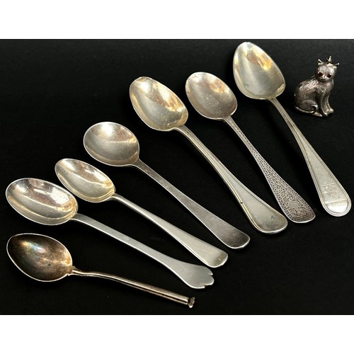 309 - Seven assorted 19th century silver spoons, a novelty silver rattle in the form of cat, a four piece ... 