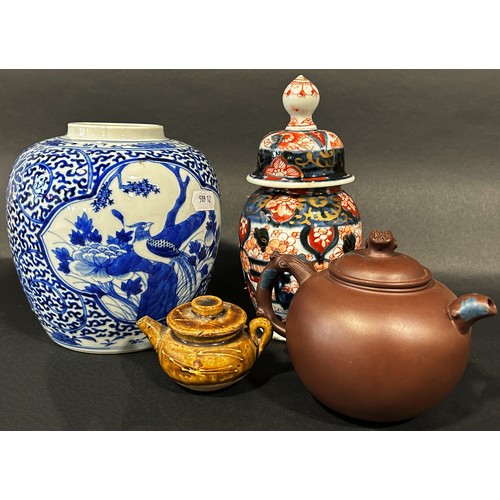 76 - An Imari vase and cover, blue and white ginger jar, Yixing clay teapot of globular form with seal ma... 