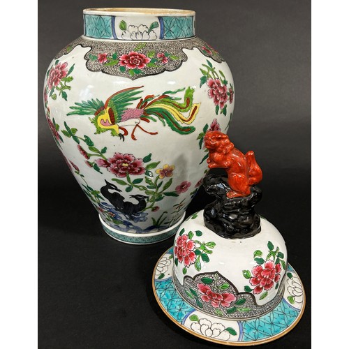 77 - 19th century Chinese jar with cover of oviform, with peony and hoho bird detail, surmounted by a tem... 