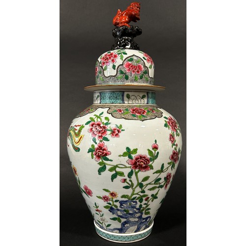 77 - 19th century Chinese jar with cover of oviform, with peony and hoho bird detail, surmounted by a tem... 