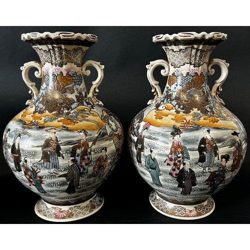 81 - Pair of late 19th century Japanese vases showing characters in extensive landscape