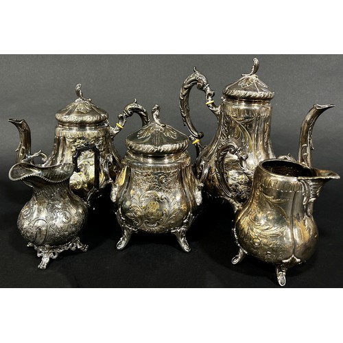 224 - A four piece French silver plate tea and coffee service, a single cream jug and a circular drinks tr... 