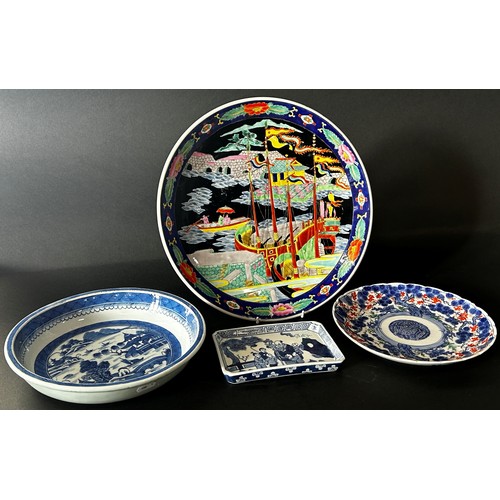 84 - Three circular Chinese porcelain dishes polychrome detail, and a further rectangular dish in blue an... 