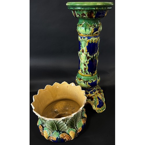 86 - A late 19th century majolica jardiniere and stand with scrolling acanthus and other detail