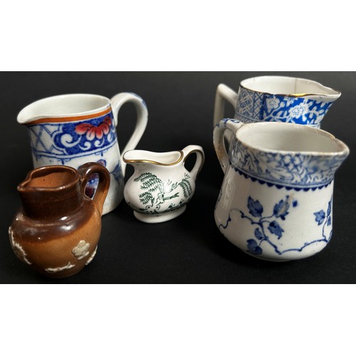 103 - Collection of 19th century and later miniature jugs by various factories (22)