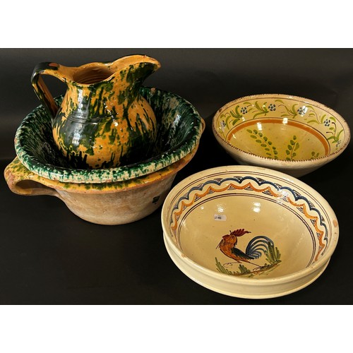 119 - Collection of 19th century continental tin glazed and other ware including a ewer, four bowls, one w... 