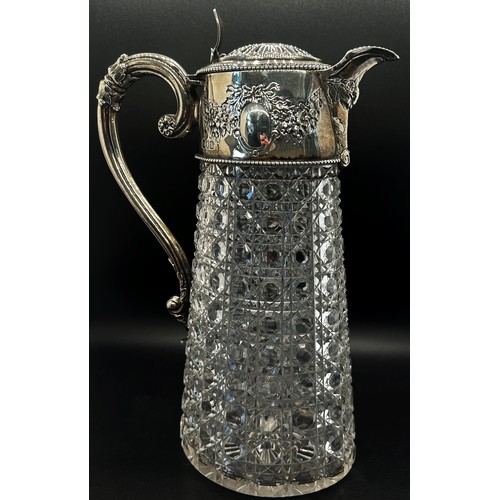 266 - A diamond cut glass claret jug with silver mounts and handle engraved with garlands, London 1896, ma... 