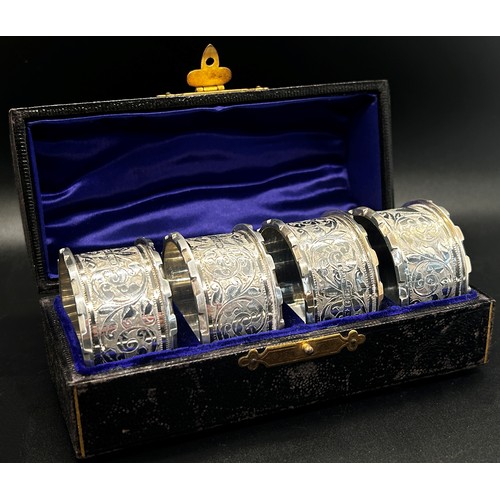 263 - A leather cased set of four matching silver napkin rings, late Victorian, Birmingham 1899, maker mak... 