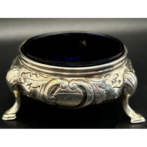 274 - A Victorian silver three legged salt cauldron with blue glass liner, a salt cauldron and mustard pot... 