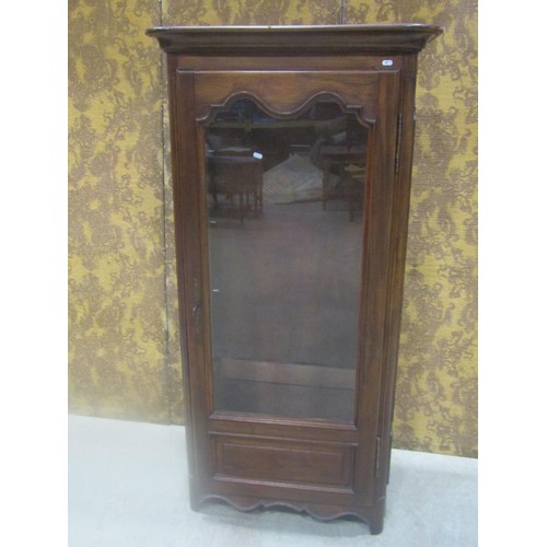 1115 - A French floorstanding vitrine enclosed by a full length partially glazed arched and moulded panelle... 