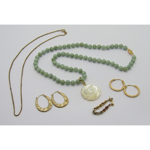 388 - Modern 14k jade bead necklace, hung with a 14k carved mother of pearl flower pendant, together with ... 