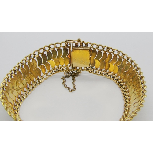 396 - Decorative foreign yellow metal bracelet with safety catch, indistinct stamps to clasp, 33.9g (safet... 