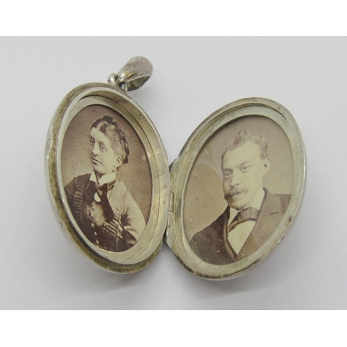 405 - Aesthetic Movement white metal locket decorated with a wall pocket of flowers in high relief, togeth... 