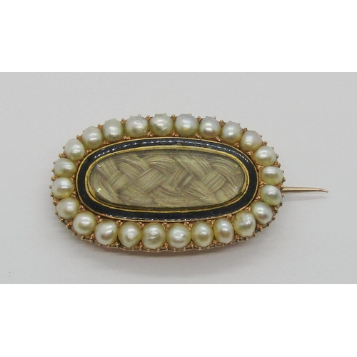 406 - Early Victorian yellow metal mourning brooch, containing woven hair framed by black enamel within pe... 