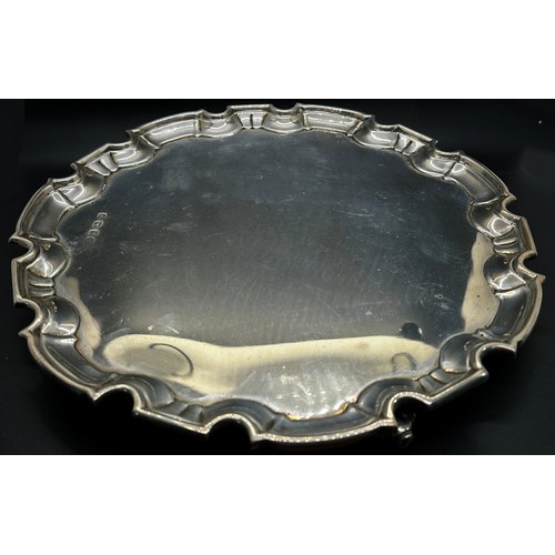 258 - A silver scalloped edge salver, raised on scrolled supports, 30cm diam, Sheffield 1922 maker William... 