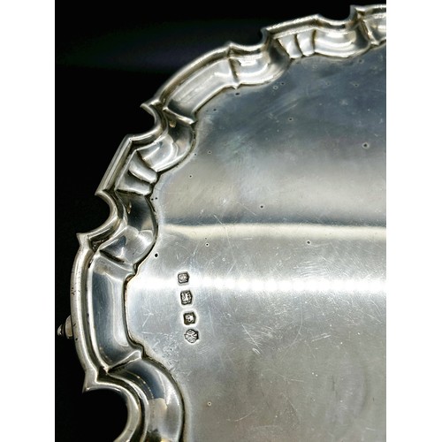 258 - A silver scalloped edge salver, raised on scrolled supports, 30cm diam, Sheffield 1922 maker William... 